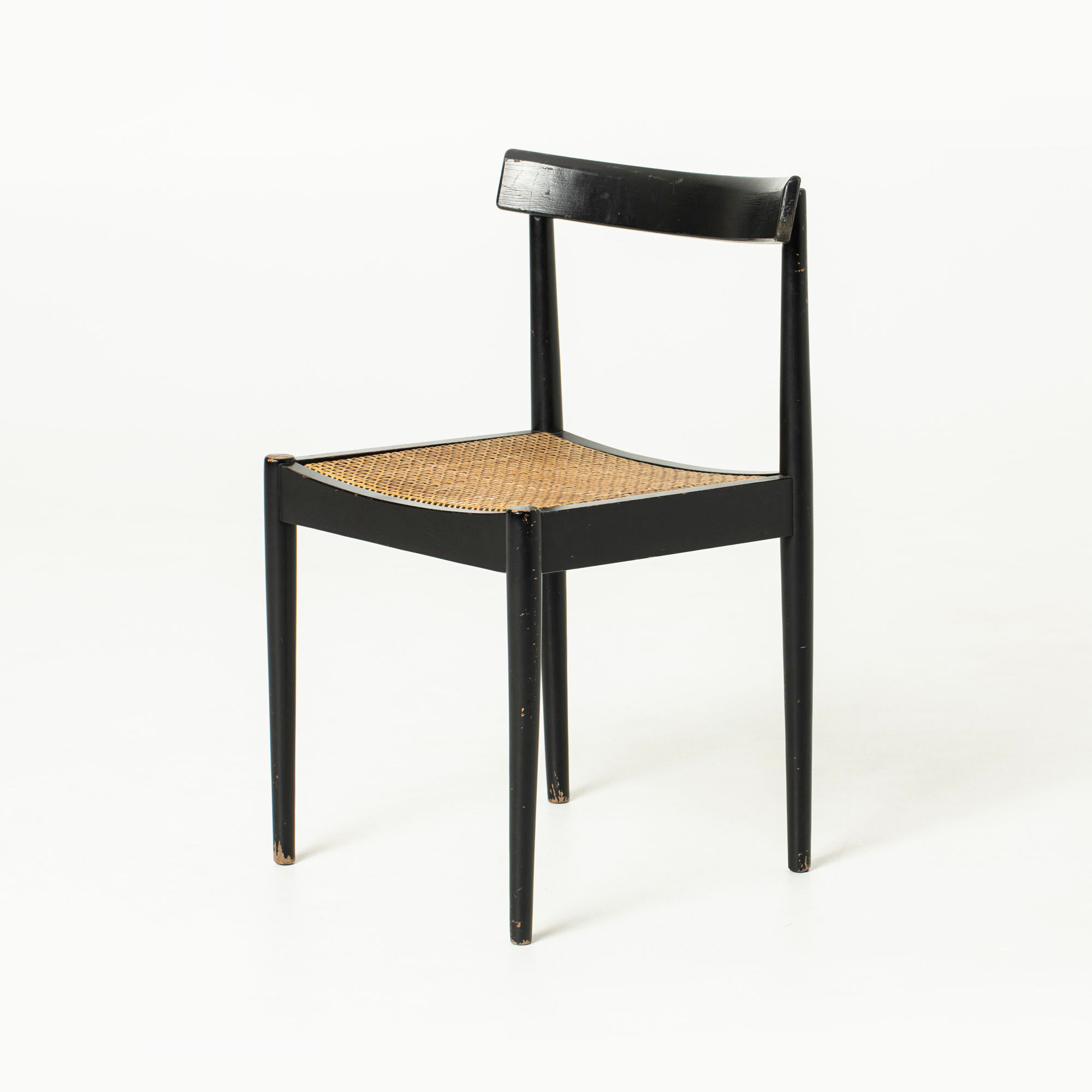 Mid-century dining chair in black laquered wood and cane