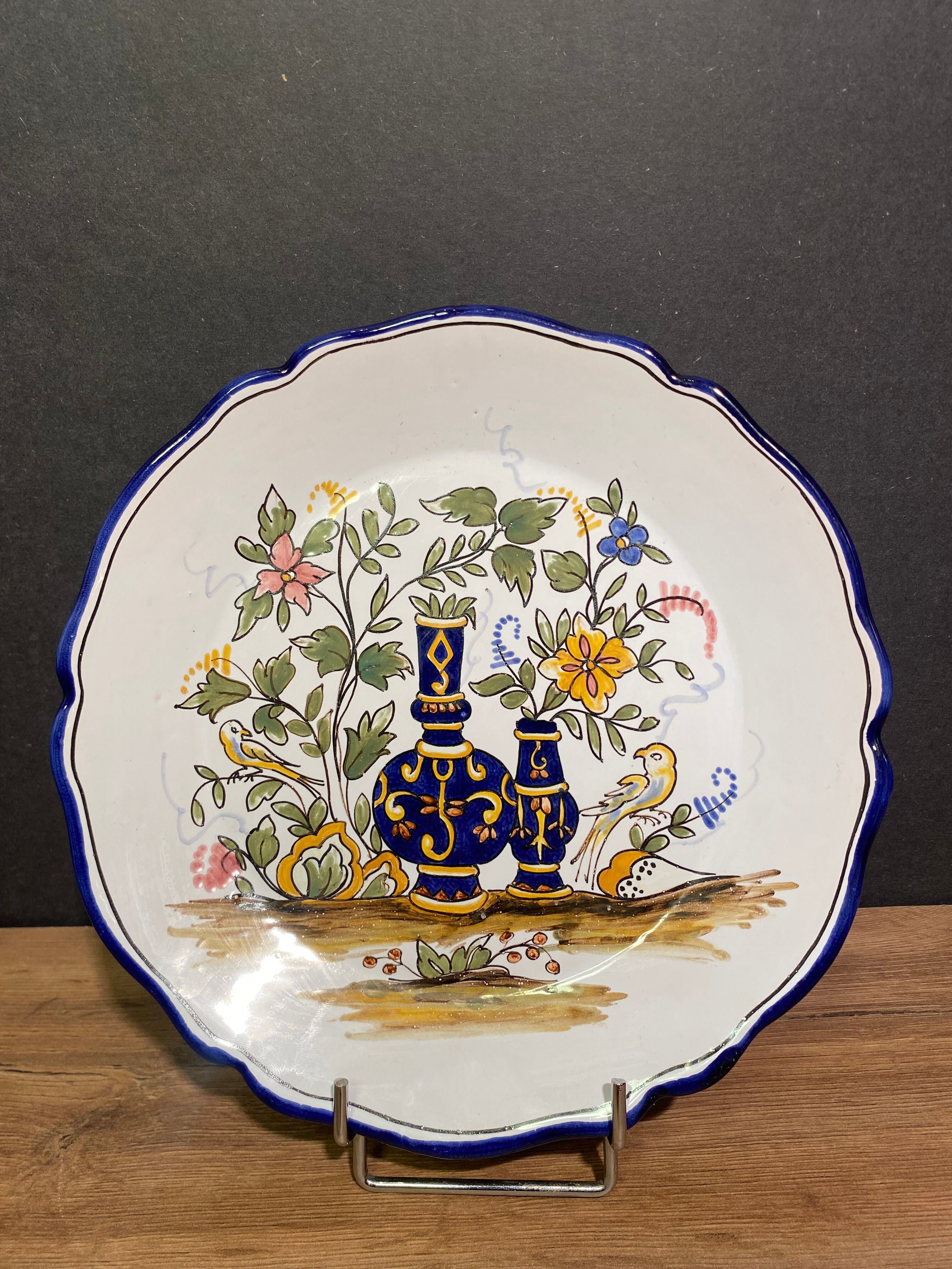 Pair of Nevers earthenware plates signed Georges