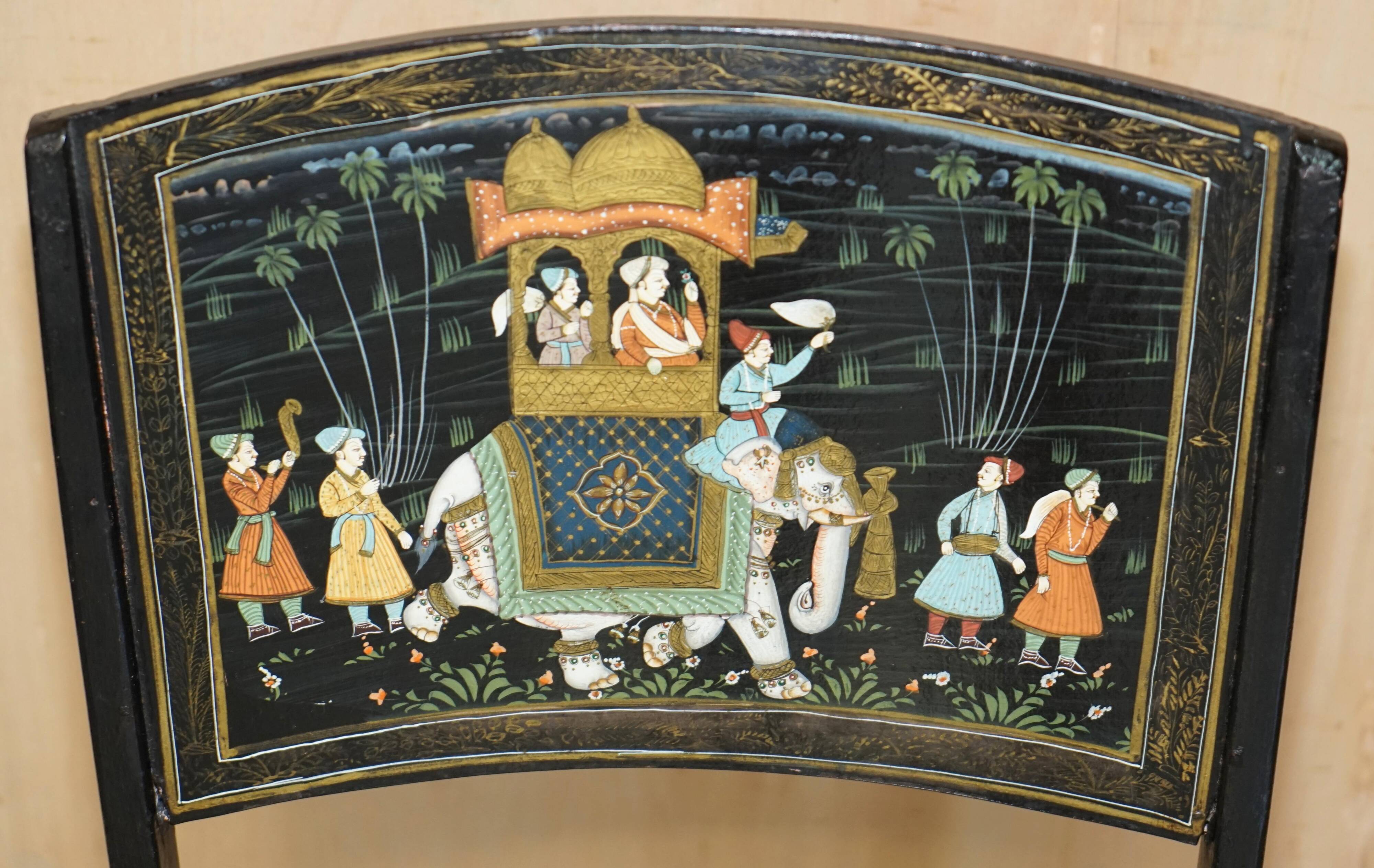 Pair of military folding chairs with Indian decoration.