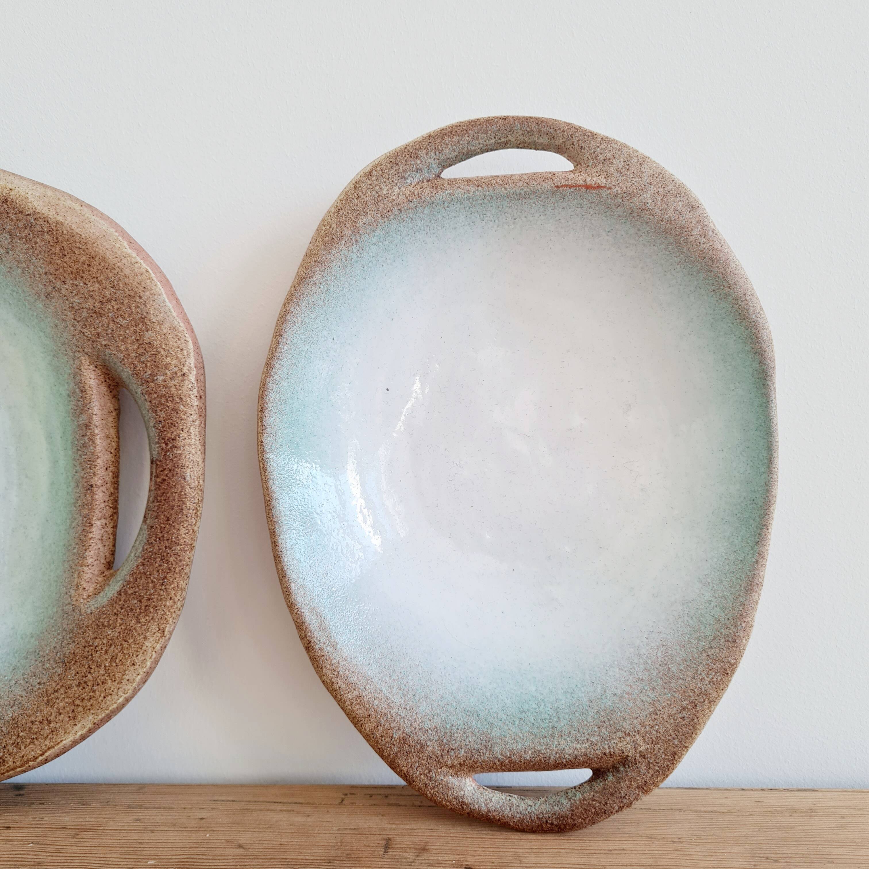 2 blue stoneware dishes