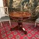 Gueridon in mahogany flame of the 19th century restoration