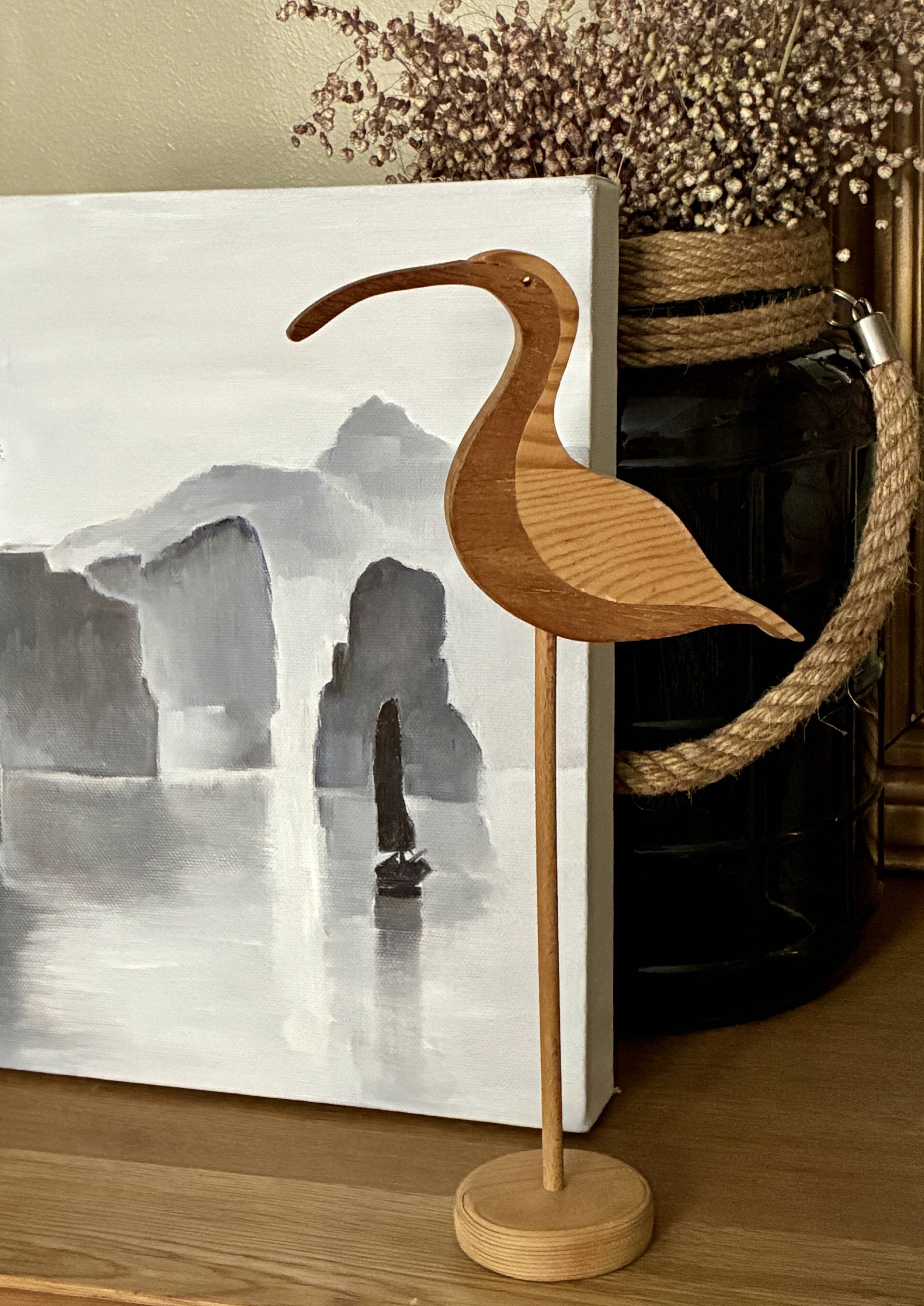Wooden wading bird on a base