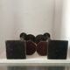 Two pairs of patinated brass candle holders