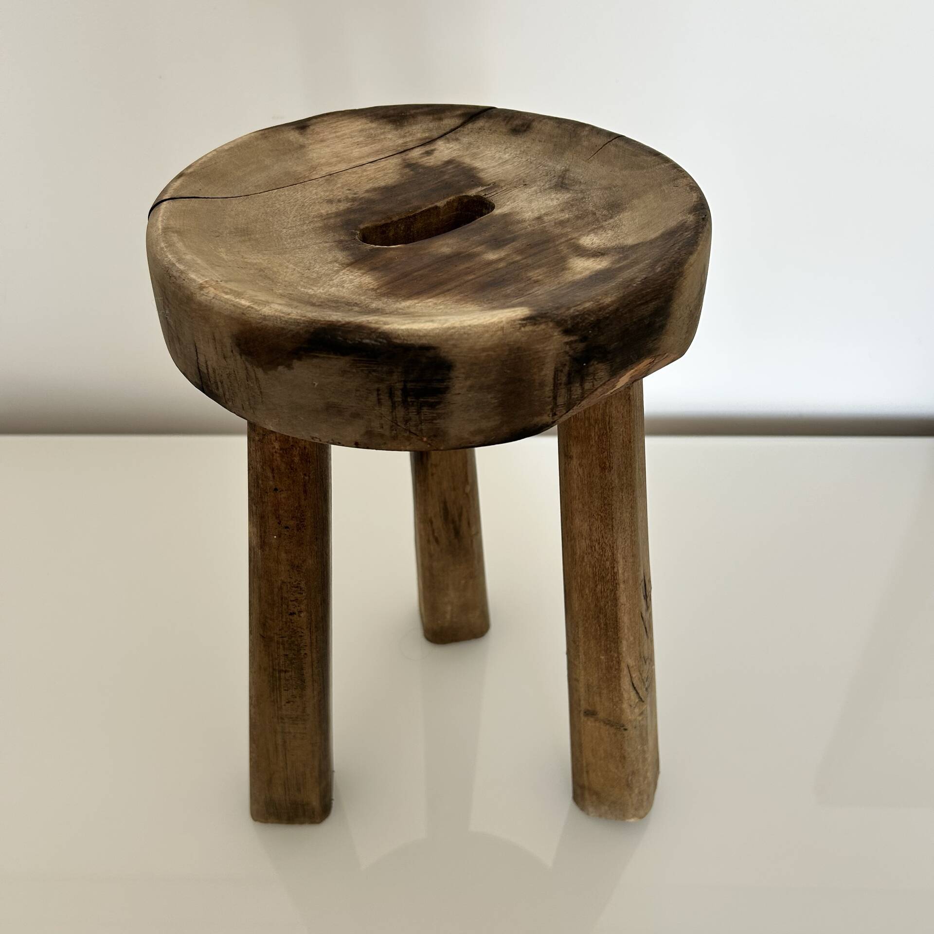 Patinated tripod stool