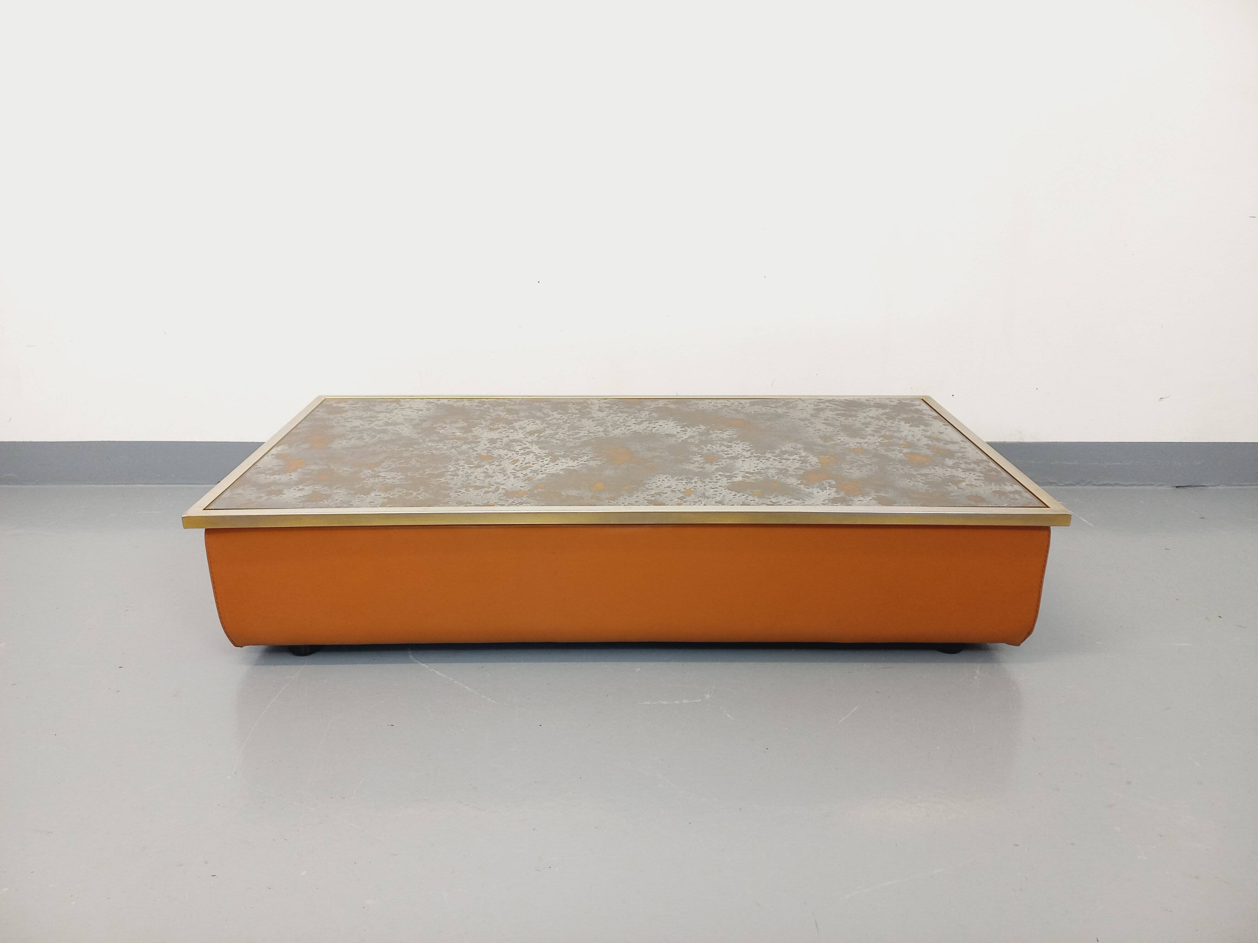 Vintage coffee table in églomisé glass, chrome and leather from the 70s