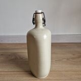 Old bottle of beige sandstone hot water bottle