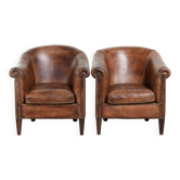 Set of 2 sturdy vintage sheepskin club armchairs with comfortable seat