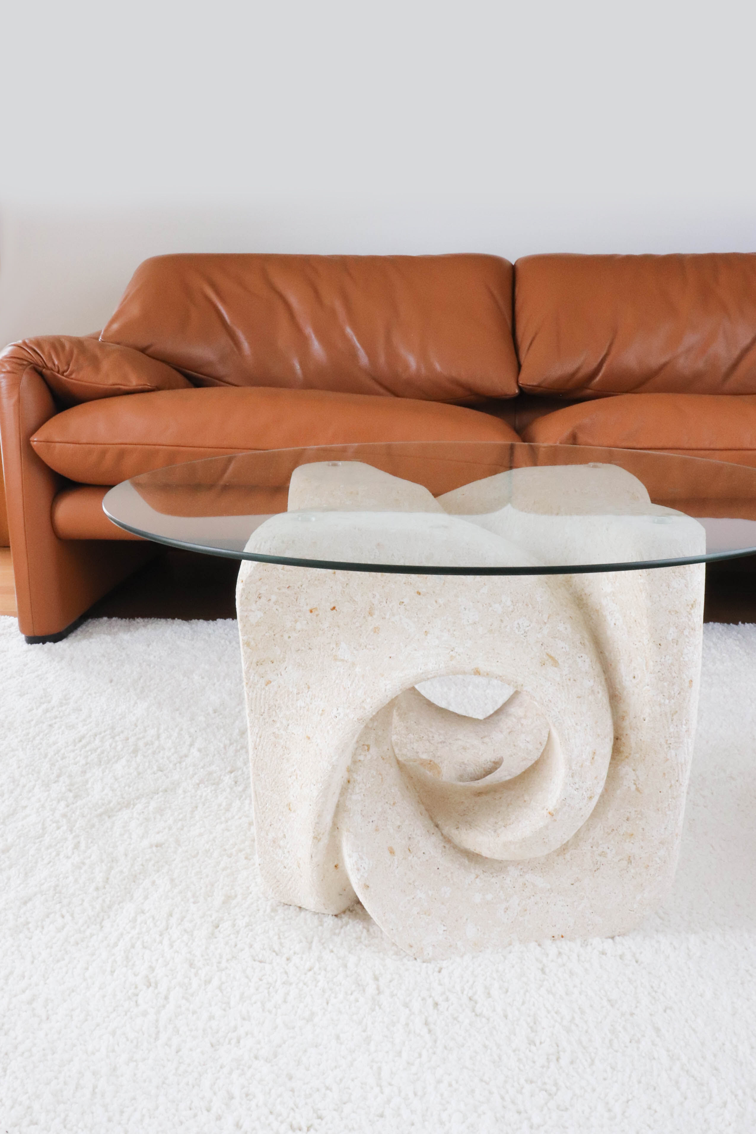 A Vintage White Stone Coffee Table with Glass Table Top