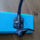 Wall coat holder with two metal pads