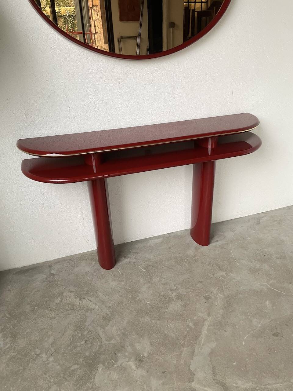 Red lacquered console and its mirror from the 80s