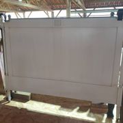 White headboard in Napoleon style with brass feet.