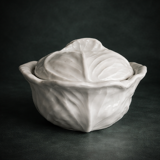 Old covered pot in 19th-century faience with cabbage decoration.