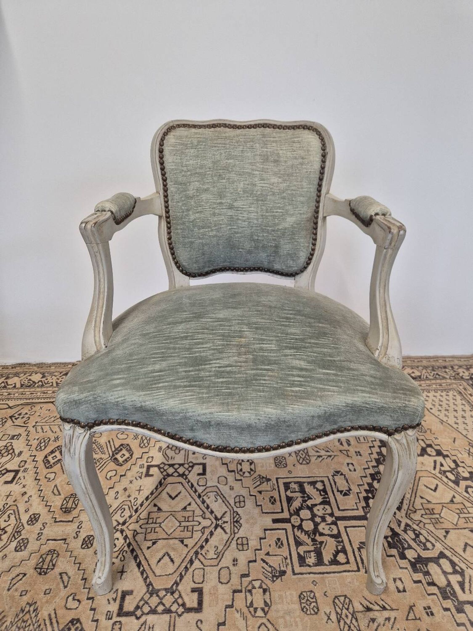 Louis XV style cabriolet armchair in patinated wood and velvet