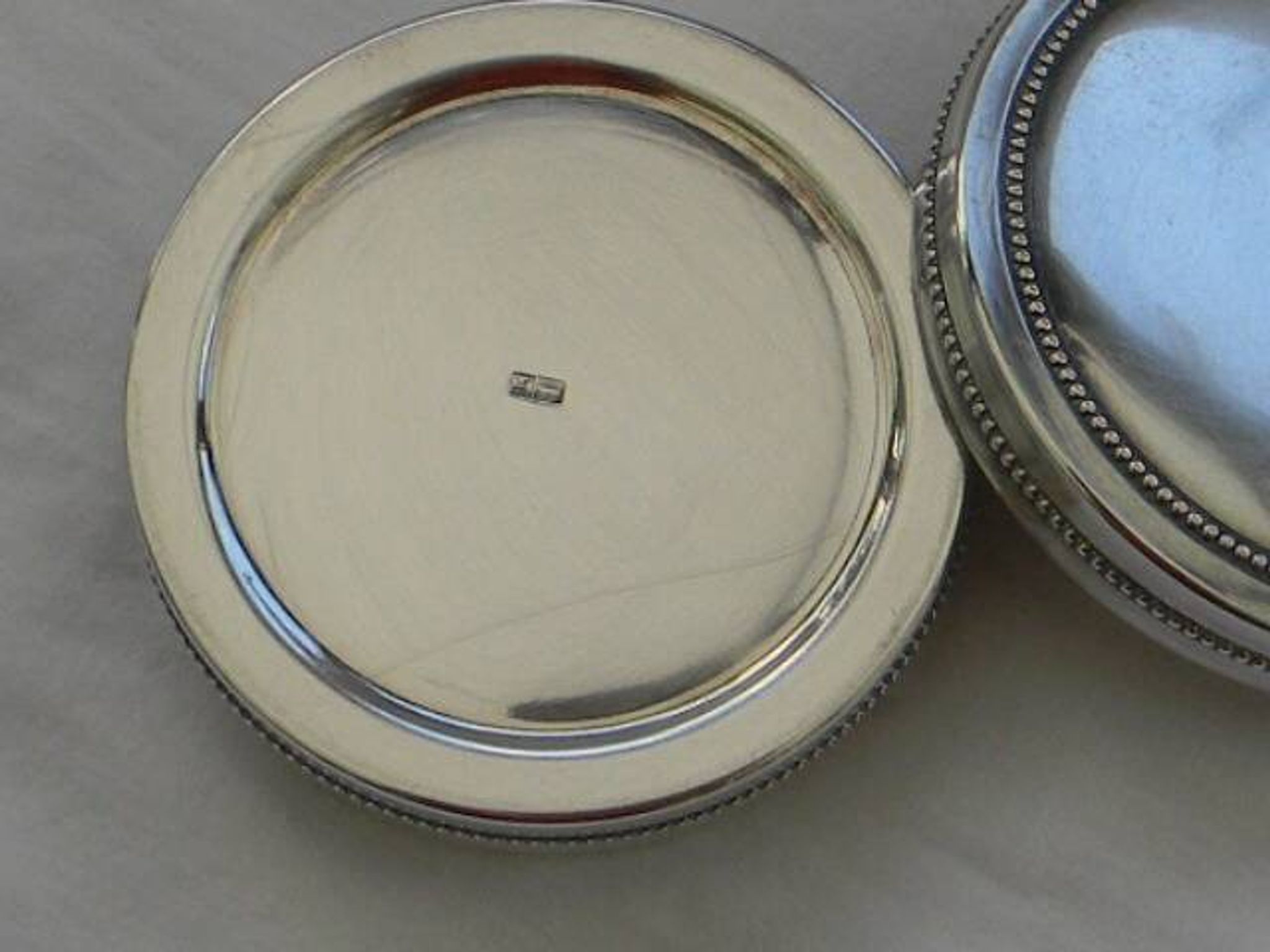 Small round silver metal box SNPA.