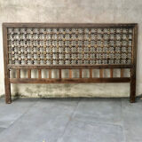 Carved wooden headboard