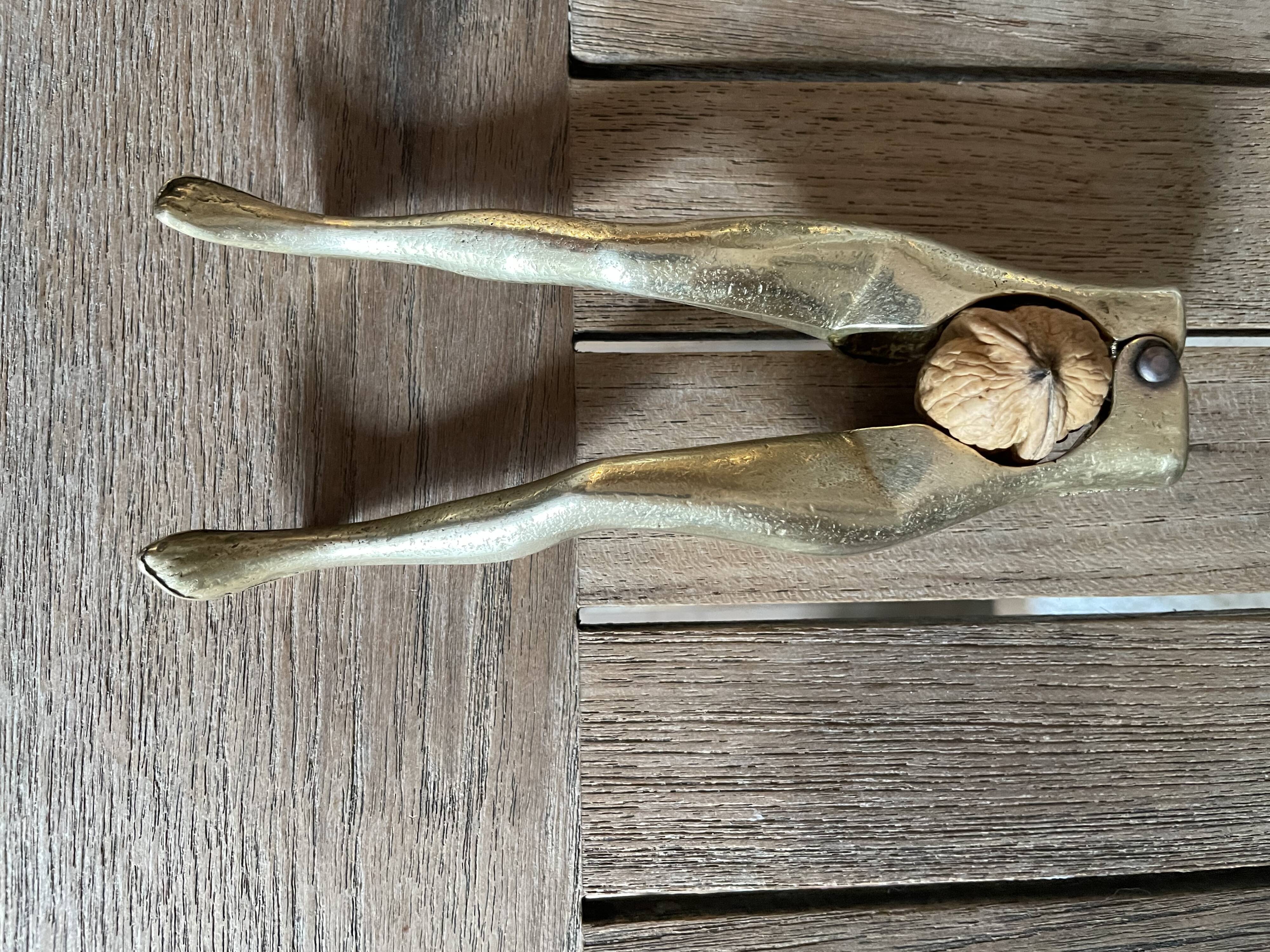 Walnut breaker in the shape of women's legs golden brass vintage