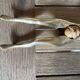 Walnut breaker in the shape of women's legs golden brass vintage