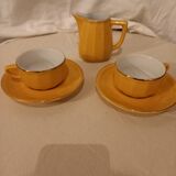 Set of two yellow Apilco coffee cups and saucers and a matching water or milk jar.