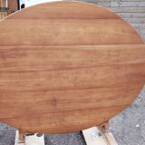 Oval table of grape harvesters from the Southwest in cherry wood