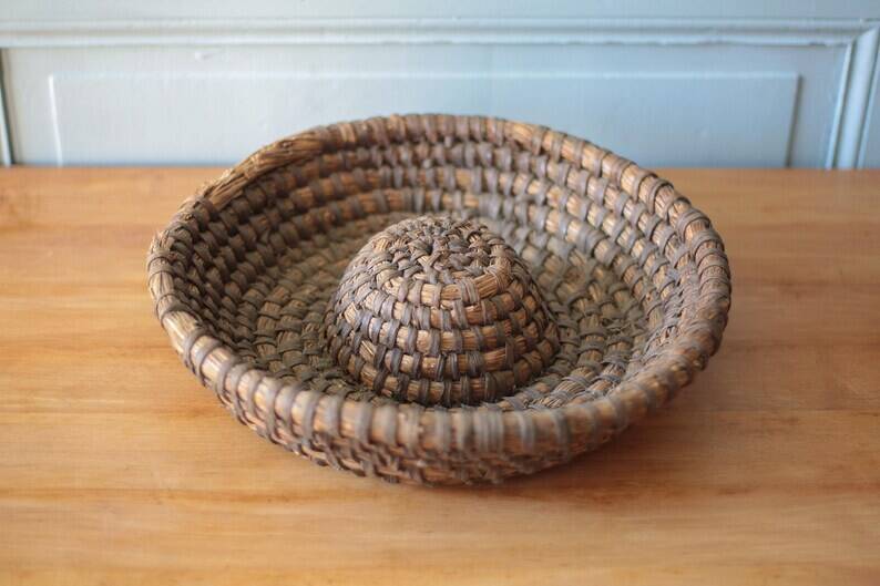 Old wicker basket, straw and bramble, woven basket, countryside, chalet, kitchen, interior decoration.
