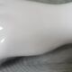 White ceramic hand wall lamp