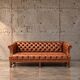 Chesterfield sofa / Brown cognac leather / Deep buttoned / 1980s