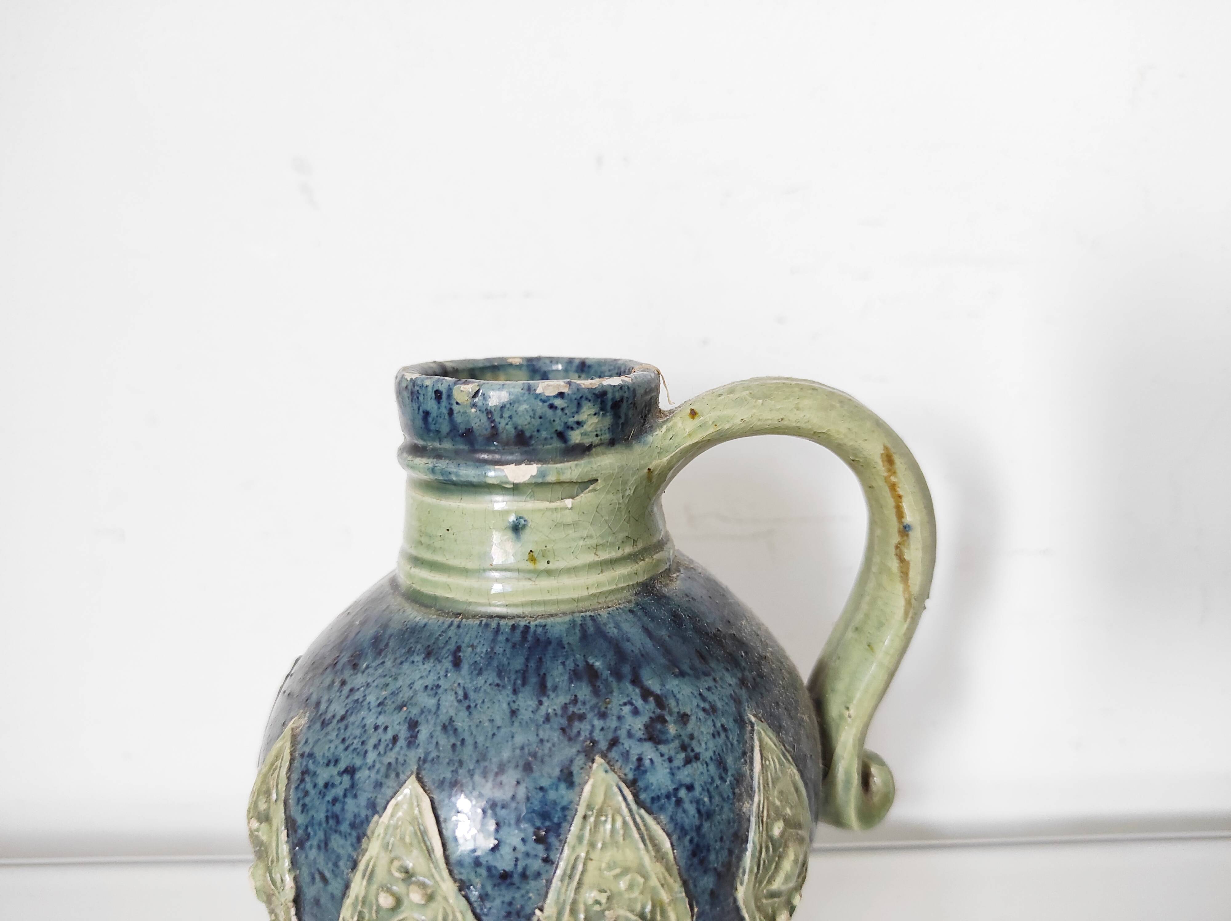Two small blue ceramic vases