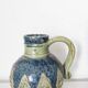 Two small blue ceramic vases