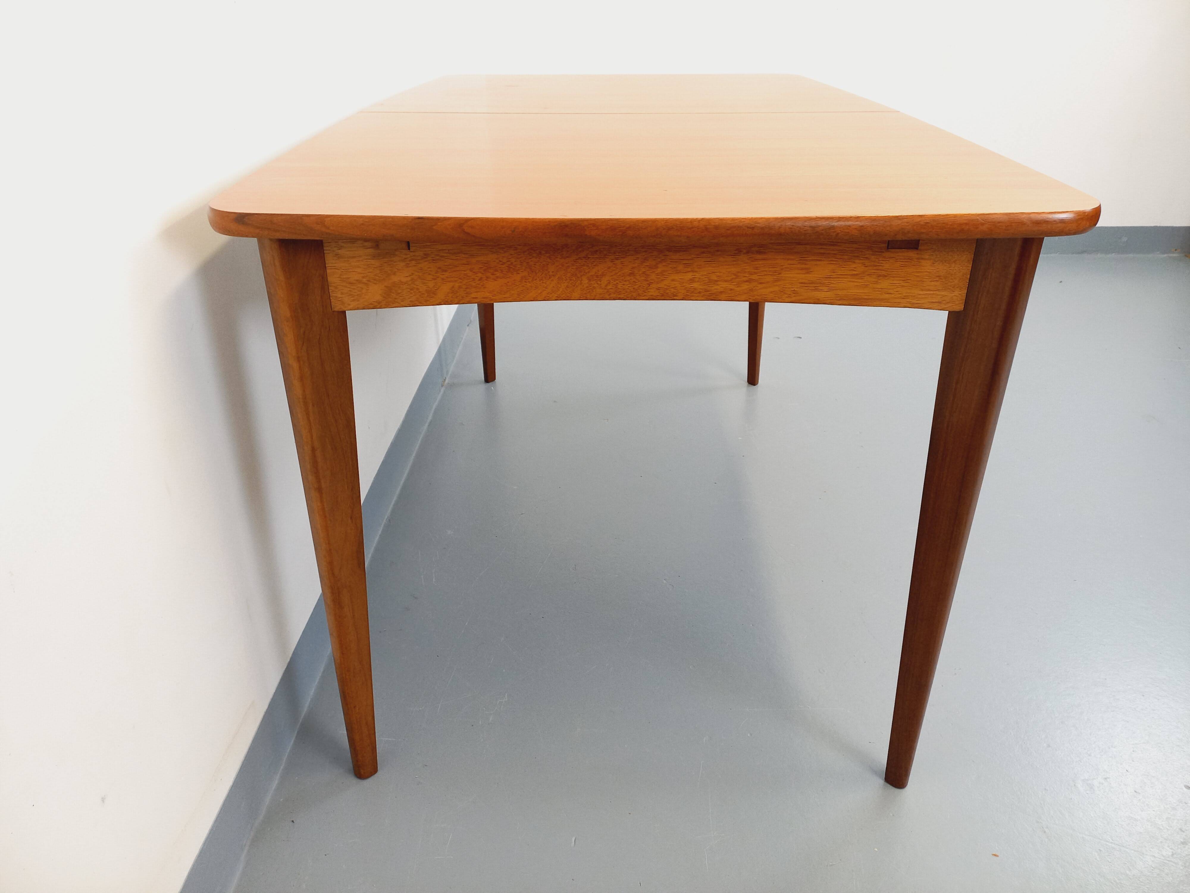 Rectangular dining table in vintage Scandinavian style from the 50s and 60s, made of teak.