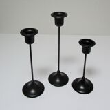 Three Scandinavian black lacquered metal candle holders