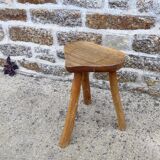 Farm stool in raw wooden sitting in the shape of a popular art