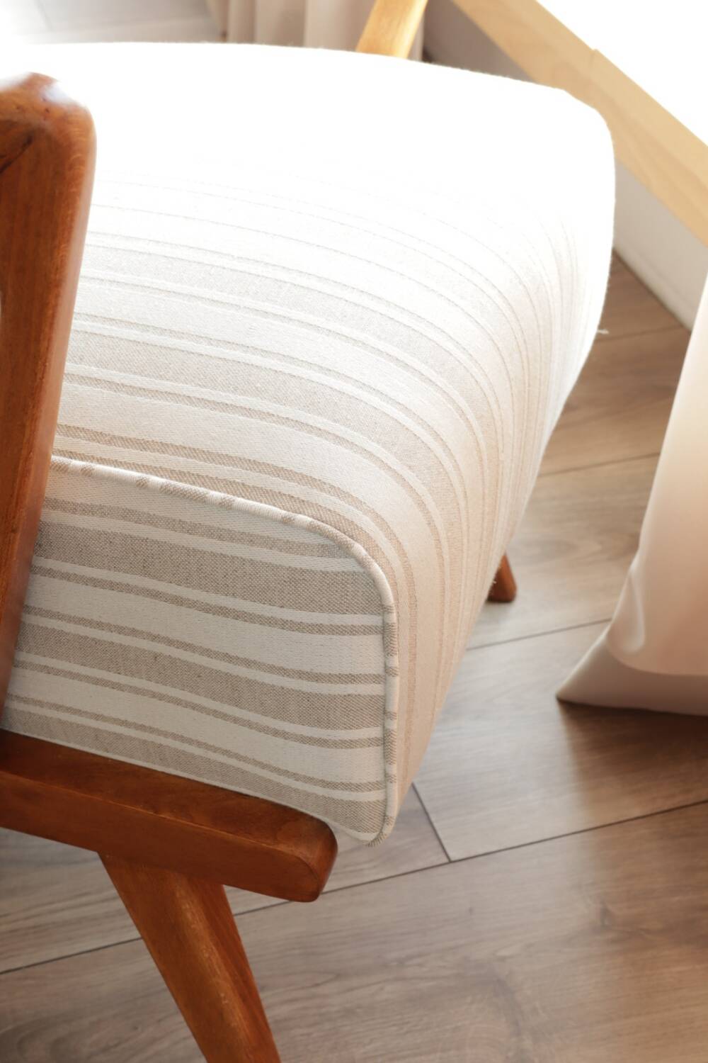 Scandinavian armchair in beige and white striped fabric