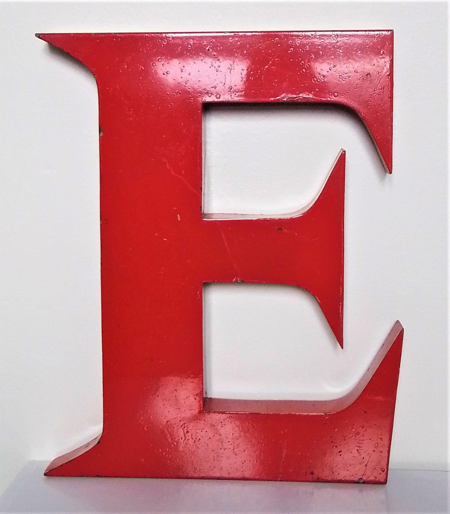 Red metal sign letter "E"