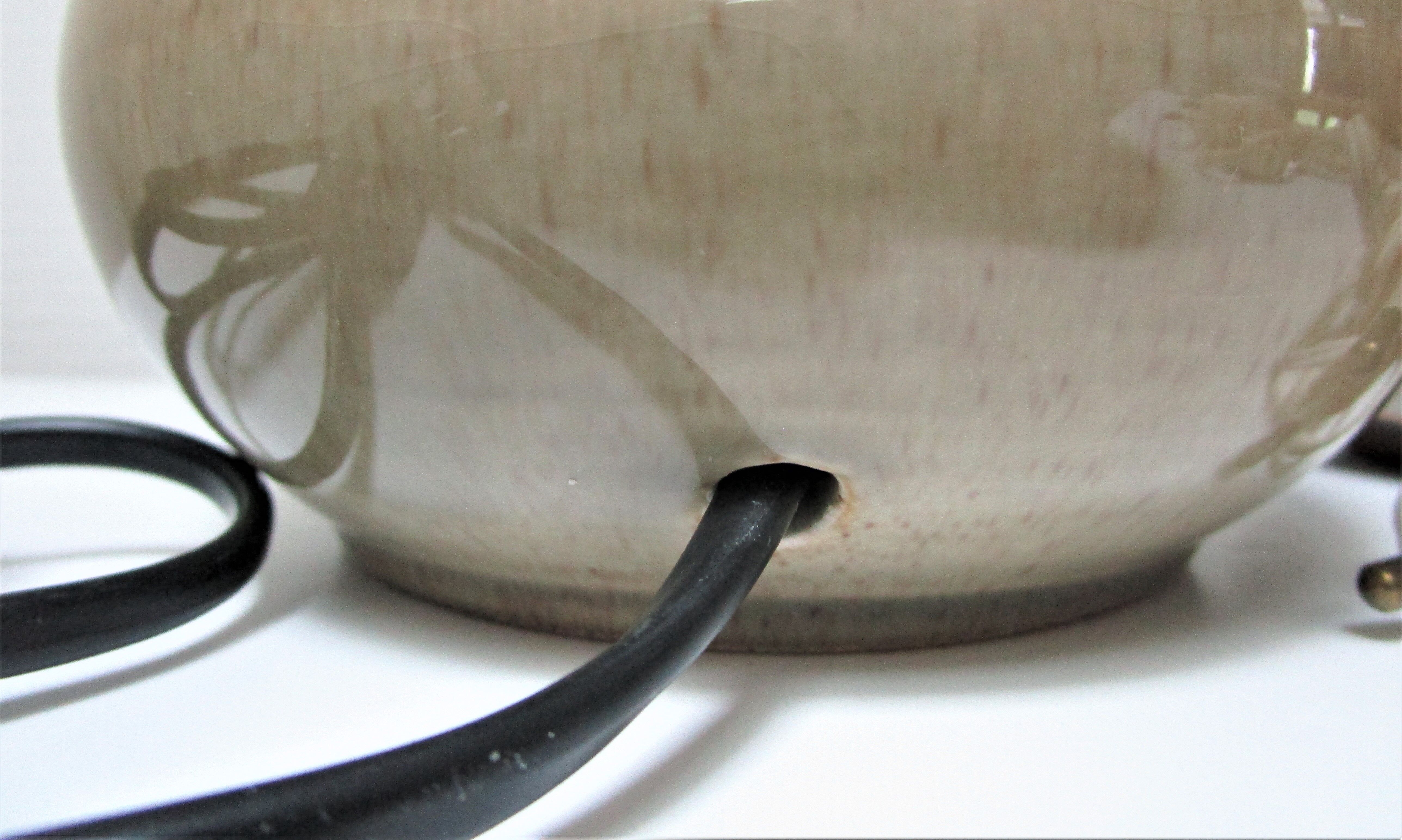 Three vintage ceramic lamps in blue, white and suede