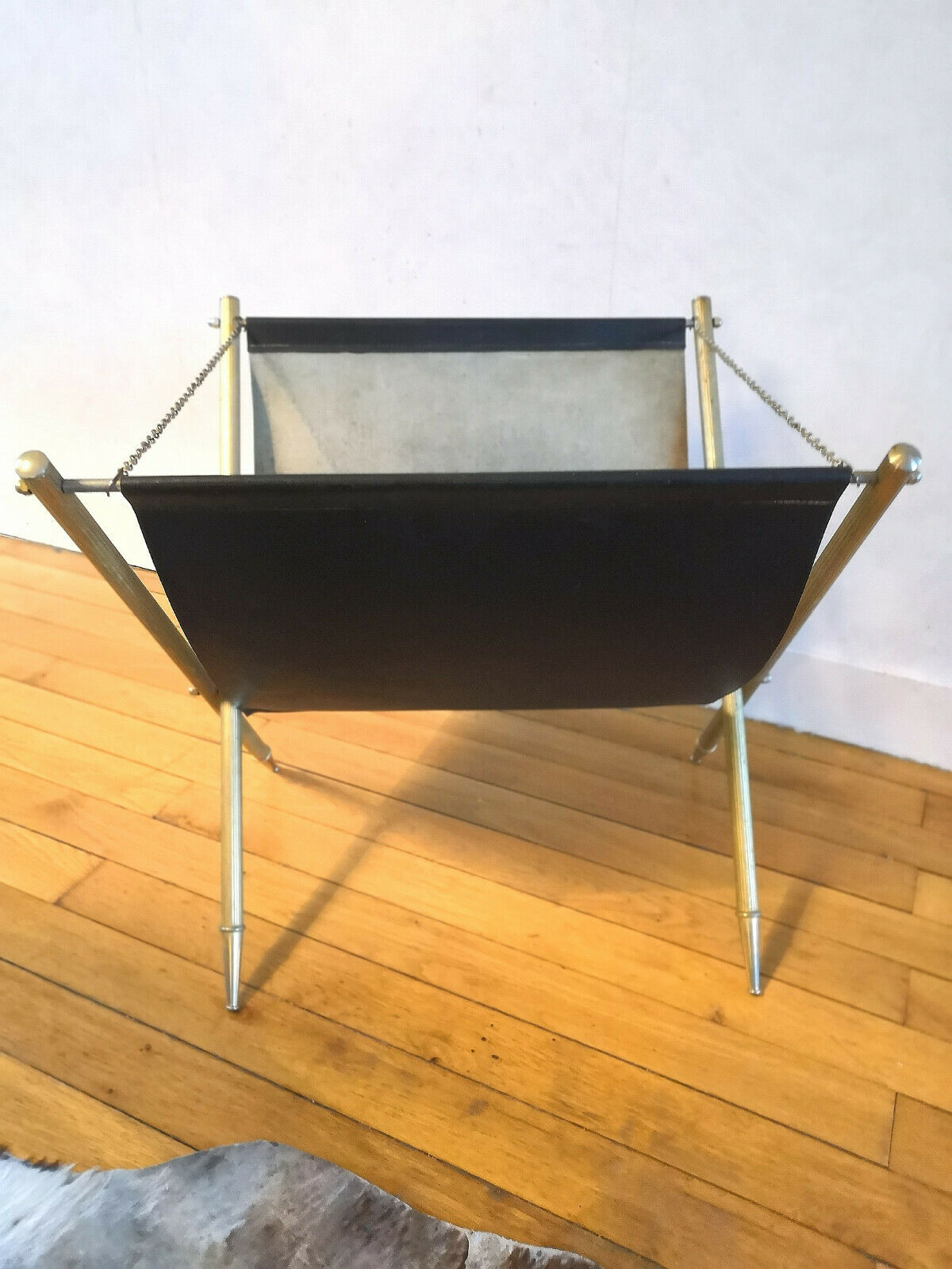 Wearing leather and brass magazines rack