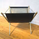 Wearing leather and brass magazines rack