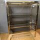 Chrome-plated brass display cabinet with smoked glass.