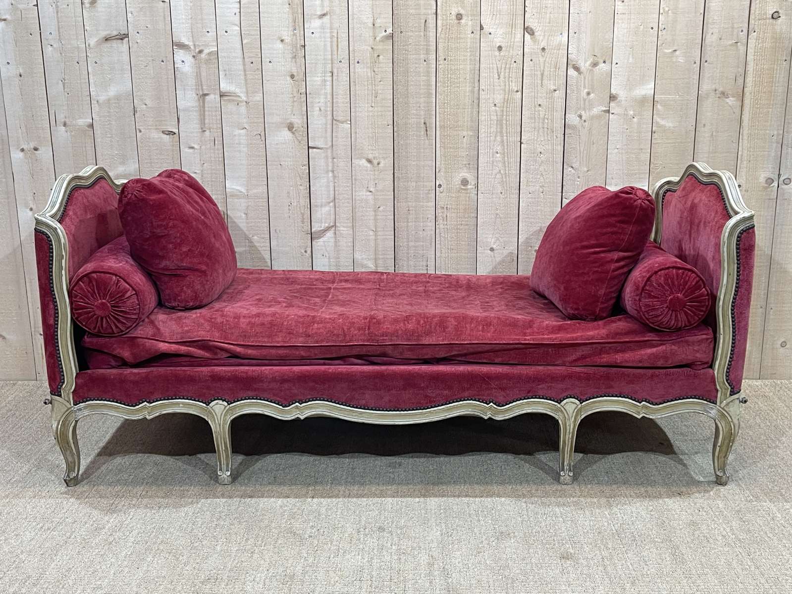 Louis XV style daybed in painted wood and covered with a red velvet