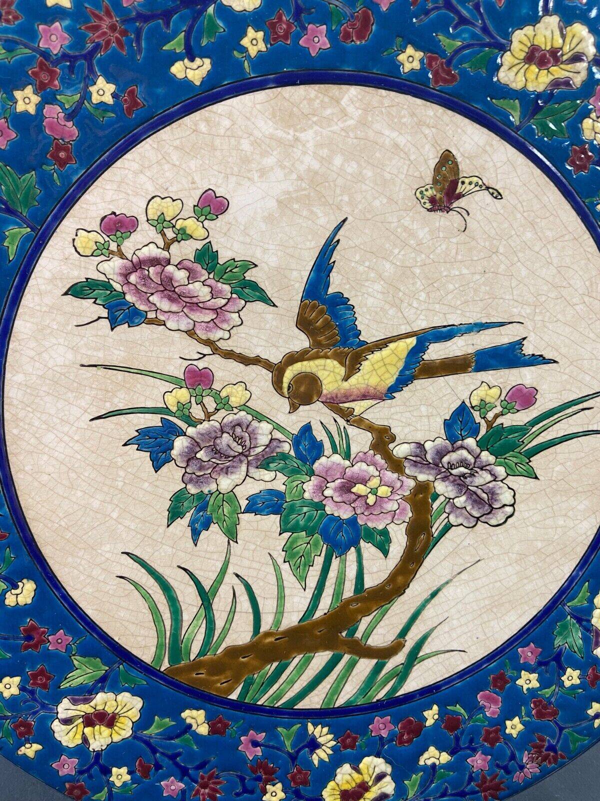 Large circular earthenware dish from Louvière with Longwy style bird decoration