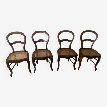 Chaises en noyer massif avec assises cannage