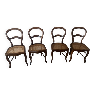 Chaises en noyer massif avec assises cannage