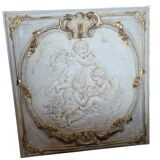 wall panel with angels in stucco and weathered wood