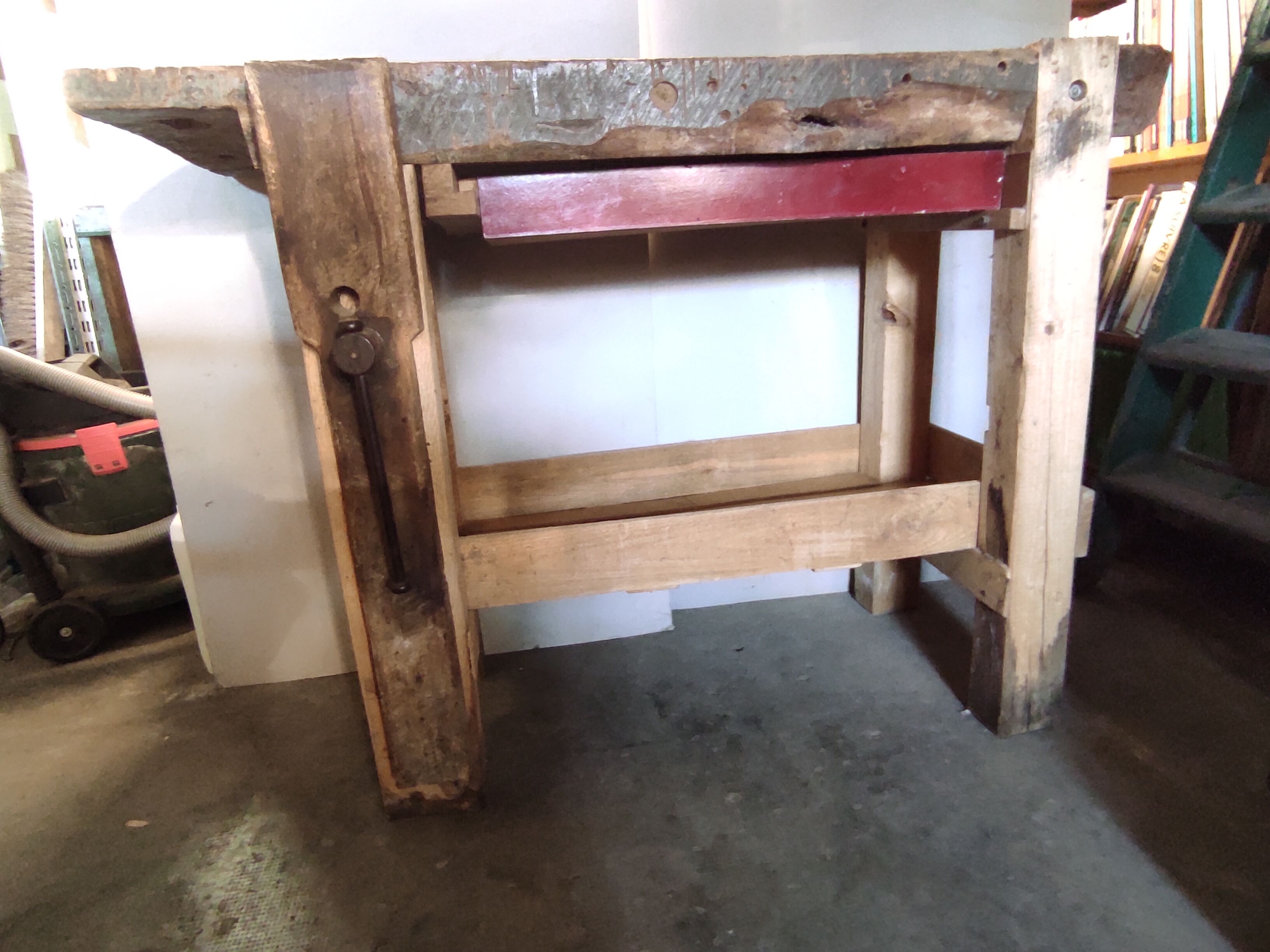 Old homemade vintage solid wood workbench with press and drawer