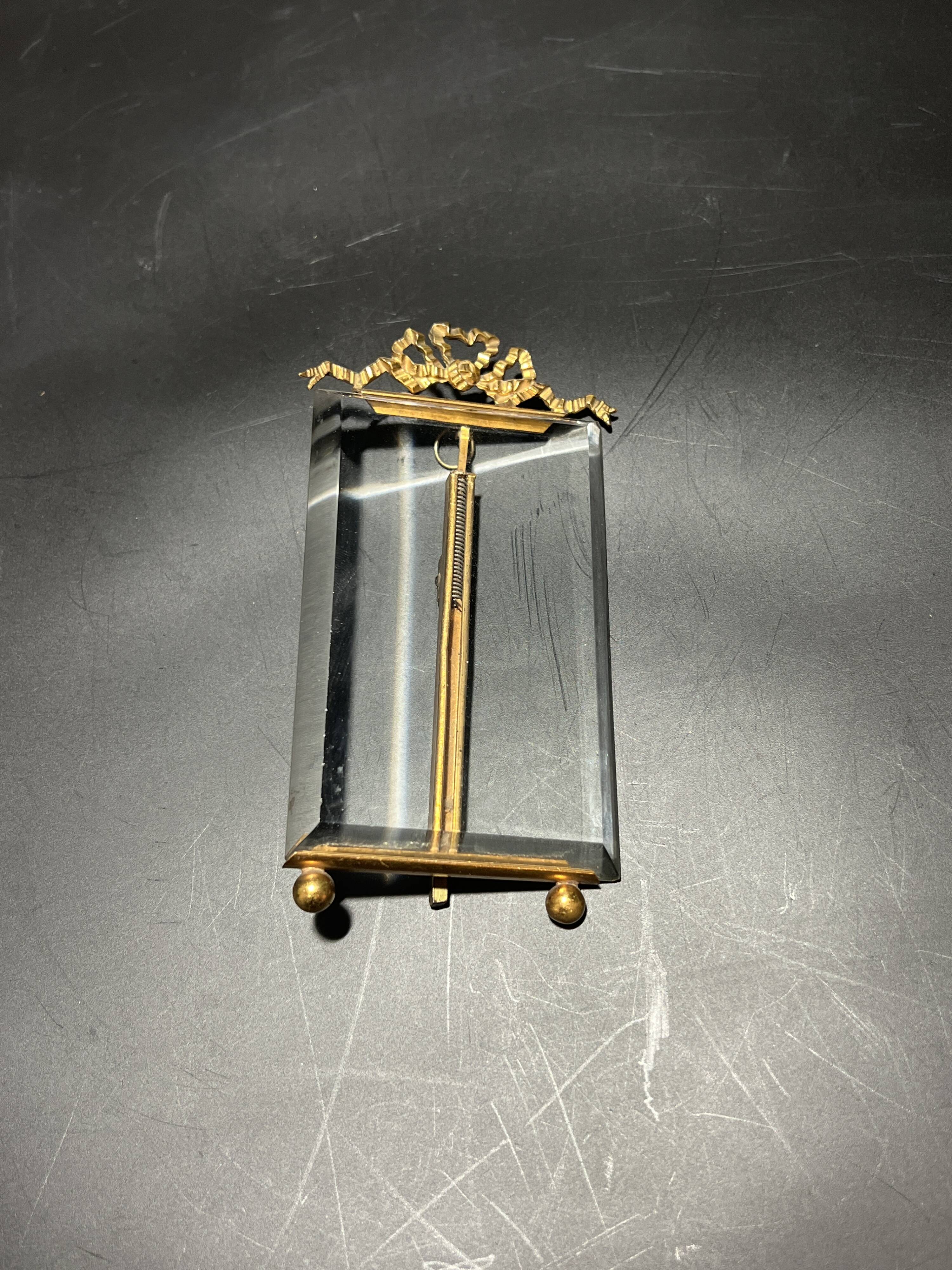 Glass and metal frame
