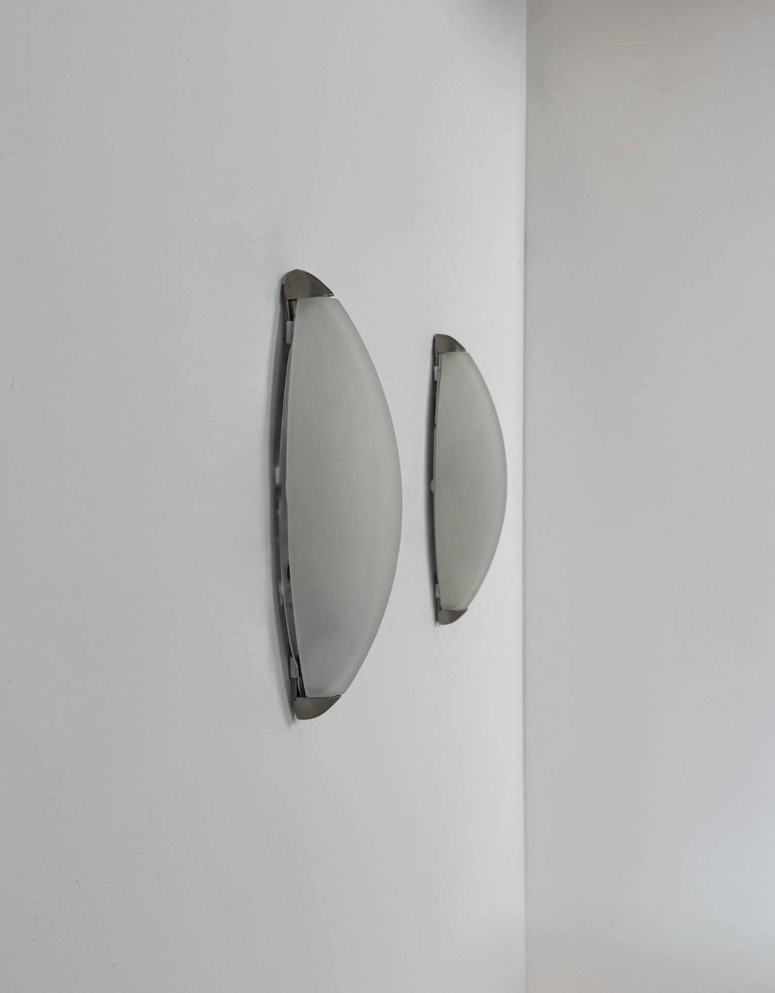 Vintage wall lights, chrome metal and frosted glass, France, 1970.
