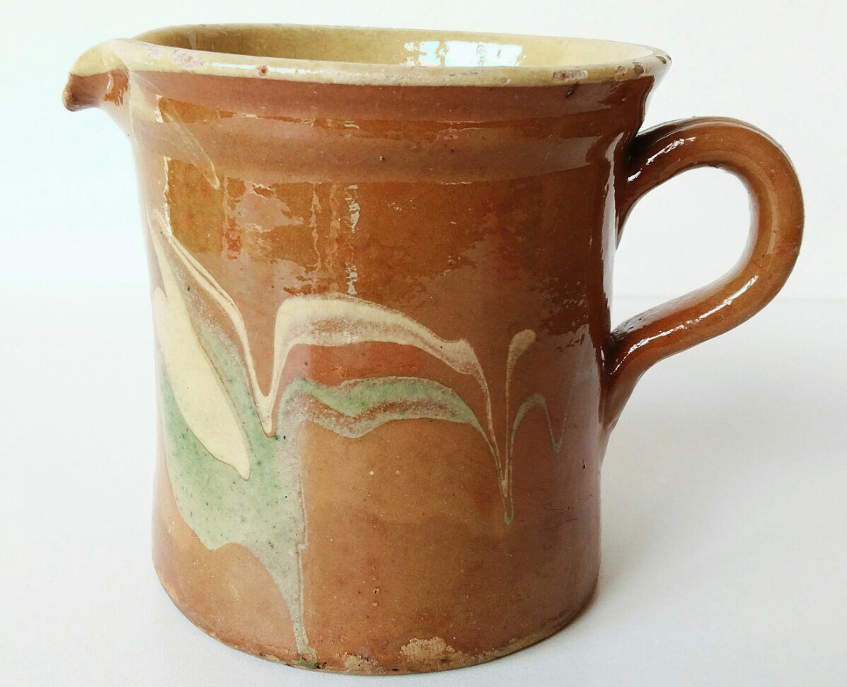 Old pitcher pot in glazed earth