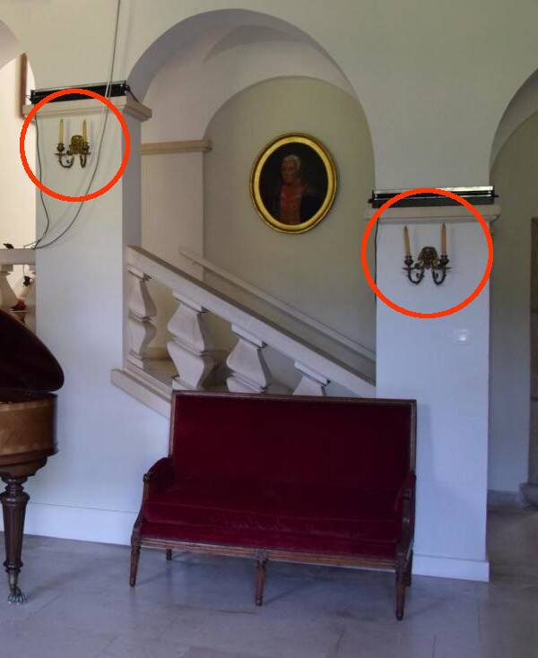 Pair of wall sconces with grotesque heads in 19th-century Renaissance style - bronze