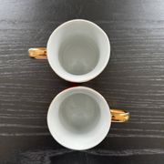 Pair of red and yellow striped cups