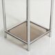 Bolster or end table in chrome steel with smoked window.