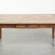 Antique pinewood coffee table with a drawer and a rural appearance